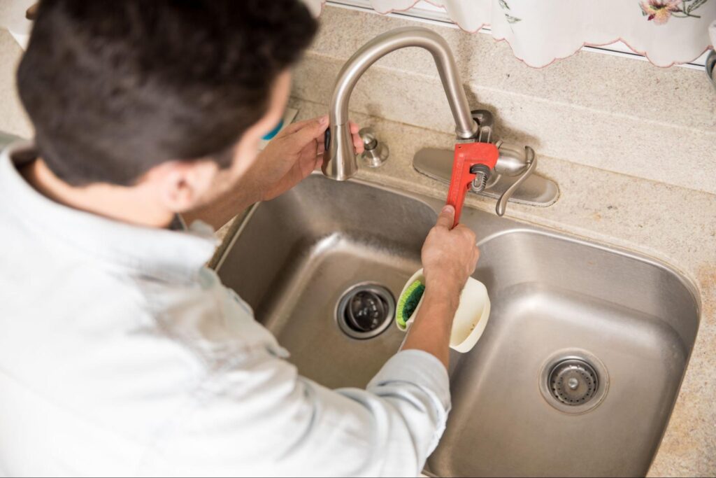 winchester-plumber-repairing-a-sink